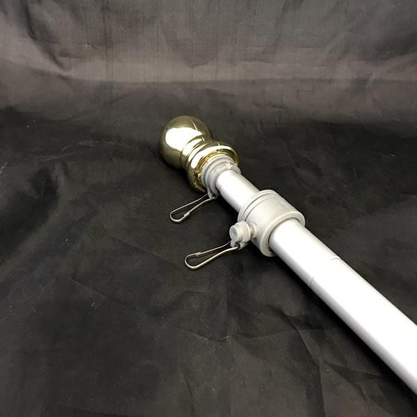Lightweight telescopic flagpole with angled bracket and gold finial